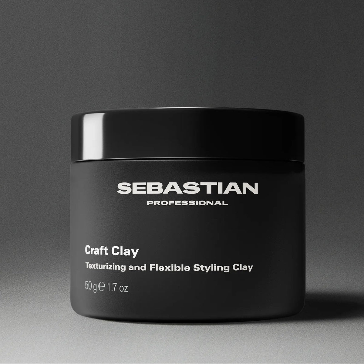 Black jar of Sebastian Professional Craft Clay on a gray background